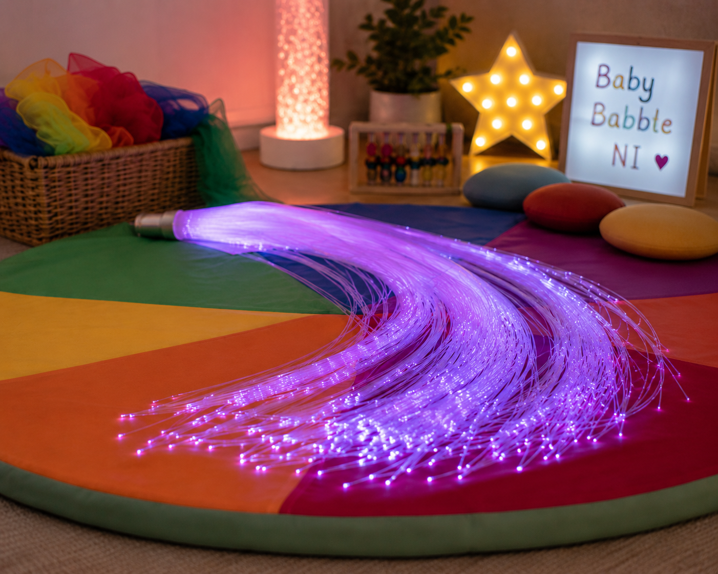 Sensory fibre-optic lights on a rainbow mat